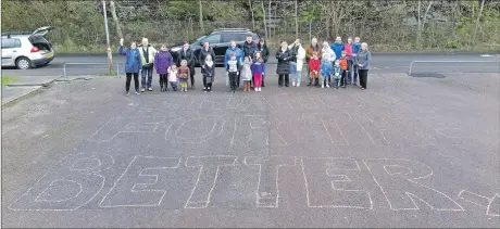  ??  ?? Volunteers and supporters of Oban Viewpoint Group laid a mile of pennies near the site of its proposed new community centre at a fundraiser on Saturday. Group chairman Andrew Macdonald said the majority of the planned location for the centre, near to...