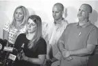  ?? JOHN MINCHILLO/AP ?? Nicole Schmidt, mother of Gabby Petito, whose death on a cross-country trip has sparked a manhunt for her boyfriend Brian Laundrie, speaks alongside other relatives during a news conference Tuesday in Bohemia, N.Y.