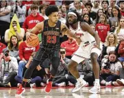  ?? JAY LAPRETE / ASSOCIATED PRESS ?? Ohio State’s Isaac Likekele defends during the second half of Thursday’s home loss to Wisconsin. He and other veterans have publicly accepted blame for not having the team properly prepared.