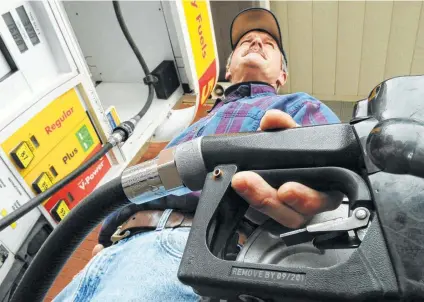  ?? File photo / Associated Press ?? Across the nation, gasoline prices are sliding. In San Antonio, they’re 2.8 cents lower than last week, “and I expect we’ll hold that trajectory again this week,” says Patrick DeHaan GasBuddy.