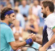  ??  ?? Roger Federer and Marin Cilic