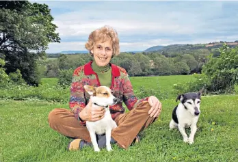  ?? ?? Revel Guest at her home near Hay-on-wye with Pepper and Patch, 2011: at the Hay festival she hosted Nobel laureates, former presidents and film stars