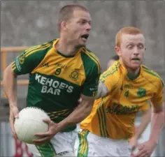  ??  ?? Conor Kinsella (HWH-Bunclody) evades Peter Goldsmith.