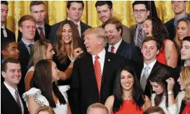  ??  ?? US President Donald Trump poses with an outgoing group of interns at the White House yesterday. Photo: AP/Pablo Martinez Monsivais