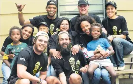  ?? Picture: Nigel Sibanda ?? EPIC. Front row: Warren Handley, left, and Tom David with family members in Joburg after the 6 000km journey that started at Kilimanjar­o in the north of Tanzania and traversed six countries.