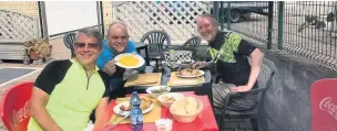  ??  ?? ●●Fuel stop. Andrew, Lawrence and Jeff enjoying a plate of risotto