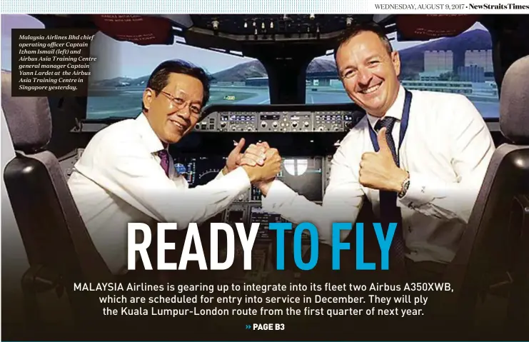  ??  ?? Malaysia Airlines Bhd chief operating officer Captain Izham Ismail (left) and Airbus Asia Training Centre general manager Captain Yann Lardet at the Airbus Asia Training Centre in Singapore yesterday.