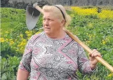  ??  ?? Dolores Leis has gained instant social media fame as a Donald Trump lookalike after she was photograph­ed standing in a field on her farm in northweste­rn Spain.