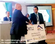  ??  ?? Mr. LalithEdir­isinghe of CINEC receiving the award from Mr. Ted Muttiah of SAGT