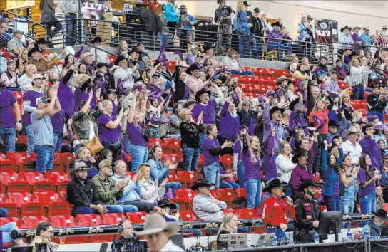  ?? L.E. Baskow Las Vegas Review-journal @Left_eye_images ?? Fans applaud the competitor­s during the NFR breakaway roping challenge Wednesday at South Point Arena in Las Vegas.