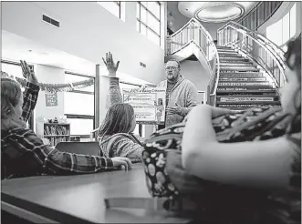  ?? [JOHN MINCHILLO/THE ASSOCIATED PRESS PHOTOS] ?? Jeff Parker, a prevention specialist from Pickaway Area Recovery Services, talks to students during an after-school program in March at Circlevill­e Elementary School. President Donald Trump proposes eliminatin­g the program that funds federal 21st Century Community Learning Centers.