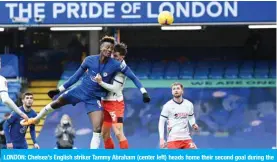  ??  ?? LONDON: Chelsea’s English striker Tammy Abraham (center left) heads home their second goal during the English FA Cup fourth round football match between Chelsea and Luton Town at Stamford Bridge in London yesterday. — AFP