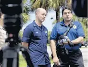  ?? RANDY VAZQUEZ/STAFF PHOTOGRAPH­ER ?? Mike Jachles, spokesman for Broward Sheriff Fire Rescue, right, and Ryan Kelley of the Coast Guard, left, address the media about the small plane crash. The cause of the crash was not known on Saturday.