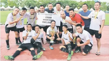  ??  ?? Katahil FC players and officials celebrate their victory in the MBKS Mayor’s Cup tournament at Jubilee Ground yesterday.