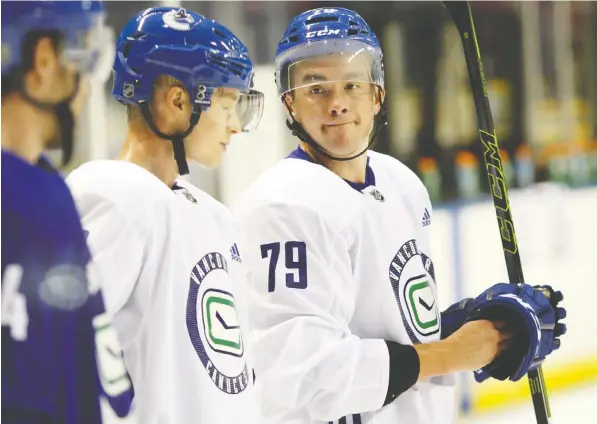  ?? — THE CANADIAN PRESS FILES ?? Micheal Ferland, right, hasn’t had a whole lot of success in his first two regular season games with the Vancouver Canucks and may find himself with new line partners Wednesday when the Canucks play their first home game, against the Los Angeles Kings.