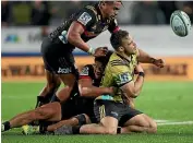  ?? GETTY IMAGES ?? Hurricanes back Wes Goosen, right, slumps after being collected high by the Chiefs’ Johnny Fa’auli.