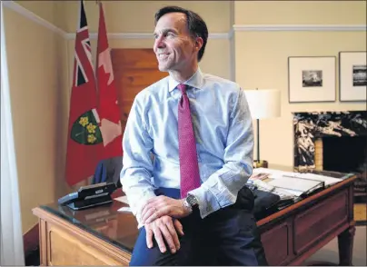  ?? CP PHOTO ?? Minister of Finance Bill Morneau is pictured in his office on Parliament Hill in Ottawa on June 6. When 2017 dawned for Morneau, he was presiding over the early stages of an economic resurgence that would lift growth beyond expectatio­ns, create jobs at...