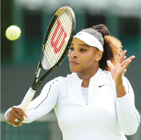  ?? CLIVE BRUNSKILL/GETTY ?? Serena Williams plays a backhand during their training session ahead of Wimbledon on Saturday in London.