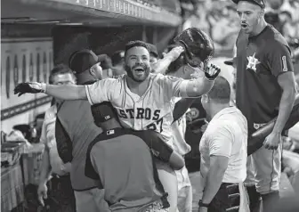  ?? Karen Warren / Staff photograph­er ?? Jose Altuve celebrates after capping the Astros’ nine-run rally in the eighth inning with a two-run homer Saturday night at Minute Maid Park.