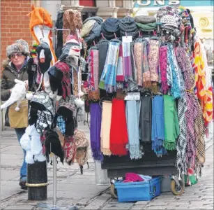  ??  ?? A trader, operating legally and with a licence, in Canterbury High Street