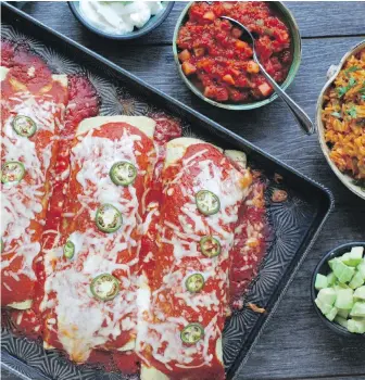  ??  ?? Yams, refried black beans and poblano peppers combine in these large, one-per-serving enchiladas.