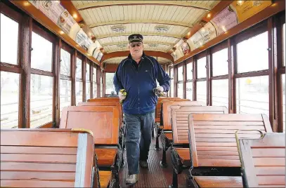  ?? (File Photos) ?? Bill Buchanan, a volunteer streetcar motorman, puts the flagship of the Fort Smith Trolley Museum through its paces in these file photos. Streetcars operated commercial­ly in Fort Smith from 1883 to 1933 and have been running a short route again since 1991, thanks to the all-volunteer efforts of the museum.