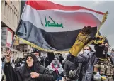  ?? EMILIENNE MALFATTO WASHINGTON­POST FILE ?? Iraqi protesters march toward Khilani Square in Baghdad in January.