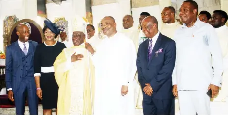  ??  ?? Akwa Ibom State Governor, Mr. Udom Emmanuel (3rd from right), and Most Rt Rev. John Obebe Ayah, Bishop, Catholic Diocese of Uyo; Speaker, Akwa Ibom State House of Assembly, Barr. Onofiok Luke and wife. From right.
Dr. Emmanuel Ekuwem Secretary to the State Government [SSG], and Rt. Air Commodore Idongesit Nkaga, after the Easter Sunday Service at the Christ the King Cathedral, Uyo.