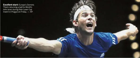  ??  ?? Excellent start: Europe’s Dominic Thiem returning a ball to World’s John Isner during their Laver Cup match in Prague on Friday. — AP