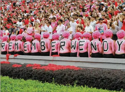  ?? CURTIS COMPTON / CCOMPTON@AJC.COM ?? Georgia fans stage a “pink out” at Sanford Stadium to bring awareness to the fight against breast cancer and to honor Arkansas State coach Blake Anderson’s wife, Wendy, who died Aug. 19 after a two-year battle with the disease.