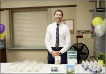  ??  ?? Director of Ancillary Services for O’Neill Health Care Jason Jacobs welcomes back patrons with cookies.