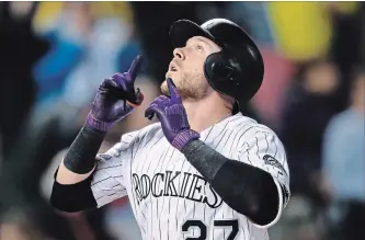  ?? DAVID ZALUBOWSKI THE ASSOCIATED PRESS ?? Colorado Rockies shortstop Trevor Story gestures after the first of his three home runs on Wednesday. While the Rockies have been to one World Series in their 26-season history, they have never won a division title.