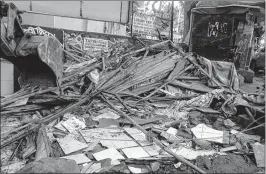  ??  ?? The demolished pandal and shop in Khar