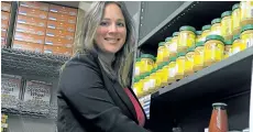  ?? RAY SPITERI/NIAGARA FALLS REVIEW ?? Pam Sharp, director of community engagement for Project SHARE, hopes the community, as part of an annual national Every Plate Full campaign, will help keep the shelves stocked this summer at the Niagara Falls food bank.