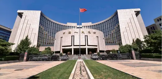  ??  ?? The People’s Bank of China lowers the reserve requiremen­t ratio for most banks by 1 percentage point on October 15