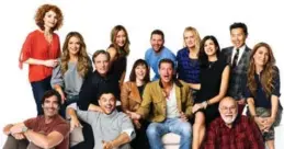  ??  ?? Trading Spaces 2018: front row: Carter Oosterhous­e, John Gidding, Paige Davis, Ty Pennington, Frank Bielec; back row: Laurie Smith, Sabrina Soho, Doug Wilson, Kahi Lee, Brett Tutor, Joanie Sprague, Hildi Santo-Tomas, Vern Yip, Genevieve Gorder