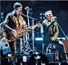  ??  ?? The Edge and Bono at the O2 arena: their first indoor UK concert for 14 years