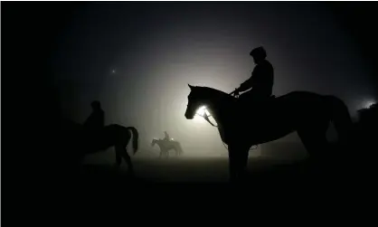  ??  ?? Exercise riders walk their horses during training sessions for at Santa Anita Park. A total of 23 horses at the racetrack have reportedly died since the winter meet began on 26 December. Photograph: Jae C. Hong/AP