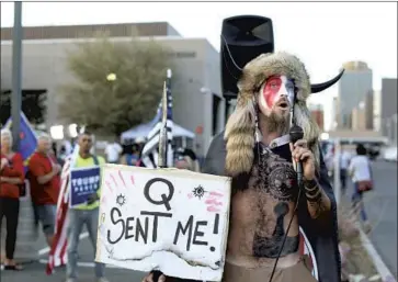  ?? Dario Lopez-Mills Associated Press ?? JACOB CHANSLEY, seen in November, thanked God from the vice president’s Senate dais amid the Capitol siege for “allowing us to get rid of the communists, the globalists and the traitors” in the federal government.