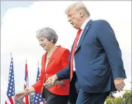  ?? Pablo Martinez Monsivais Associated Press ?? THERESA MAY is doing “a fantastic job,” President Trump said, after a tabloid interview in which he criticized the prime minister as well as immigratio­n.