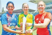  ?? — BCCI ?? (from left) Indian captain Harmanpree­t Kaur, her Australian counterpar­t Meg Lanning and England’s skipper Heather Knight pose with the Commonweal­th Bank T20 Internatio­nal Tri-series Trophy.
