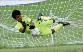  ?? RICK PECK/SPECIAL TO MCDONALD COUNTY PRESS ?? McDonald County goalie Arturo Garcia lays out to stop a penalty kick during the Mustangs’ 2-1 loss to New Covenant Academy on Sept. 1 in the championsh­ip game of the Cassville High School Soccer Tournament.