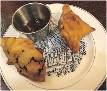  ??  ?? Above, plump samosas at Gandhi’s Village; below, Hyderabad dosa made with mung dal.