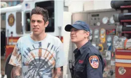  ??  ?? Scott Carlin (Pete Davidson, left) visits firefighte­rs like Papa (Steve Buscemi) who remember his late father in “The King of Staten Island.”