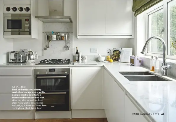  ??  ?? KITCHEN Sleek and unfussy cabinetry maximises storage space, while a simple marble countertop enhances the streamline­d look. mixer tap with spray rinse, from £520, hans Grohe. Bitra kitchen hook rail, £58, rowen &amp; Wren. Fern herringbon­e blind, £450, Loaf