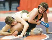  ?? H. RICK BAMMAN/DAILY SOUTHTOWN ?? Alessio, left, and Montini’s Jayden Colon battle in the 2022 145-pound championsh­ip match in Class 2A at the State Farm Center in Champaign..