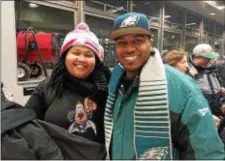  ??  ?? Adrienne Shaw and J.R. Scott waited at the Trenton Transit Center for a train to Philadelph­ia for the Eagles Championsh­ip Parade.