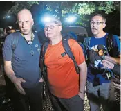  ??  ?? British cave divers, from left, Rick Stanton, Robert Harper and John Volanthen arriving to help with the rescue operation