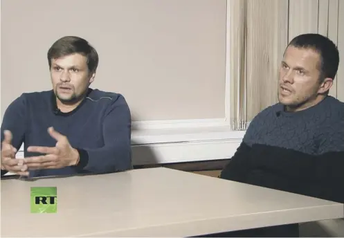  ??  ?? 0 Ruslan Boshirov, left, and Alexander Petrov are interviewe­d on the Kremlin-funded RT channel in Moscow