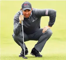 ?? — AFP file photo ?? Harrington lines up his putt on the 1st green during his third round on day three of the British Open Golf Championsh­ip at Royal Troon in Scotland.